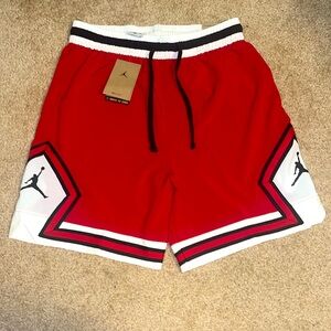 For sale are these brand new never worn medium-sized JORDAN Dri-Fit red shorts.
